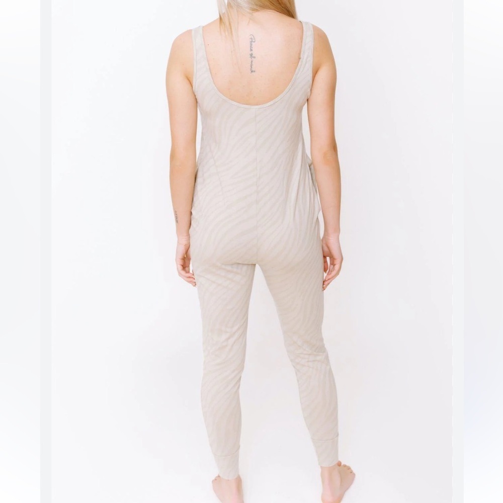 Smash and Tess Tuesday’s romper in tan tiger XS EUC